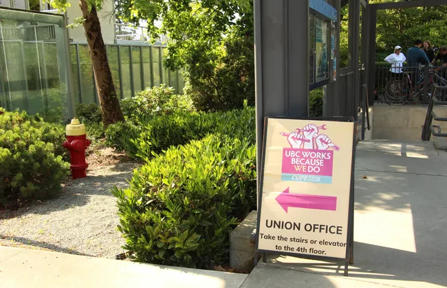 A sign posting towards CUPE 2278's office at the UBC Vancouver campus.