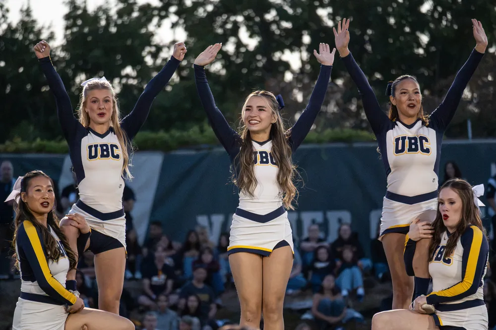 The UBC Cheer Team performs during halftime.