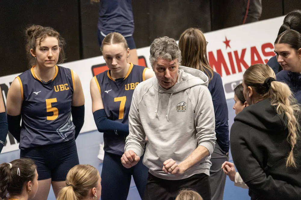 Coach Reimer addresses his players during a timeout.