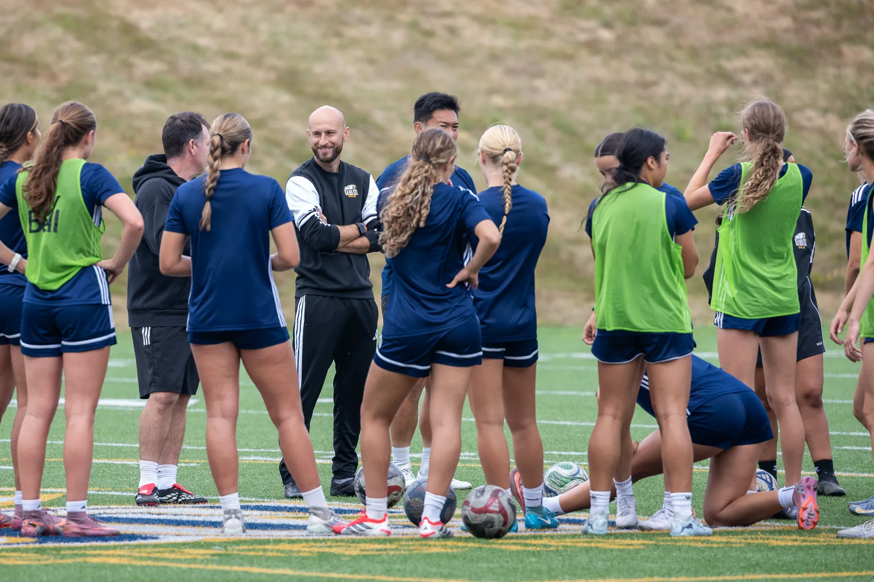 UBC Thunderbirds women's soccer players gather together before or during a match as they prepare for the 2026–27 season.