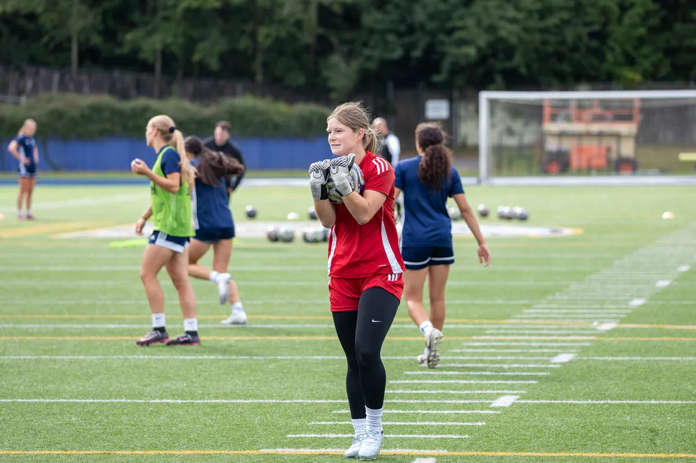 A UBC Thunderbirds women's soccer goalkeeper prepares during a practice.