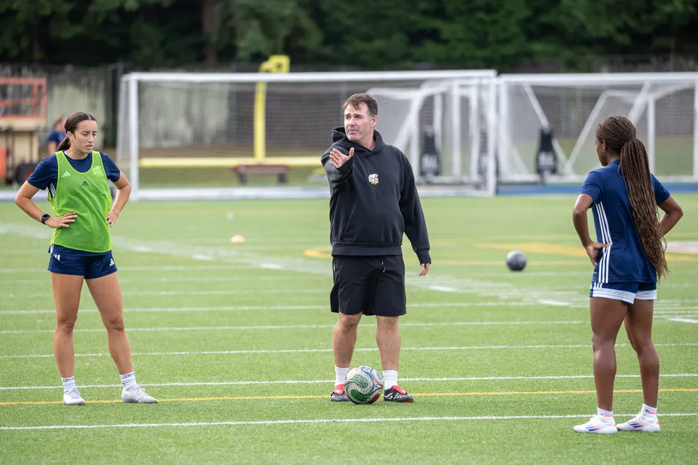 Symons coaches two of his players.