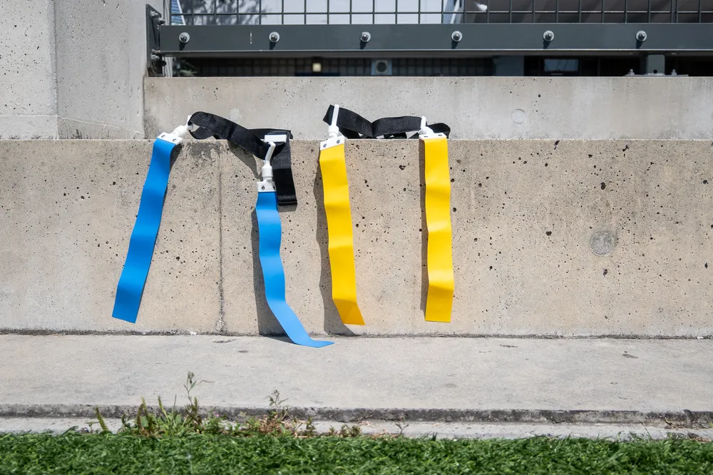Two flags, one blue and one yellow, used to play flag football.