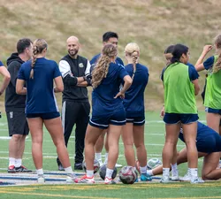 UBC Thunderbirds women's soccer players gather together before or during a match as they prepare for the 2026–27 season.