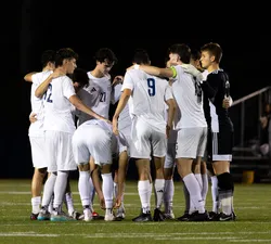 UBC's men's team huddles up.
