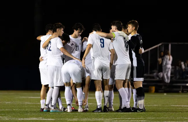 UBC's men's team huddles up.