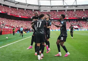 Canada players celebrate after scoring another goal against Qatar.