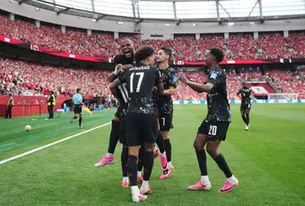 Canada players celebrate after scoring another goal against Qatar.
