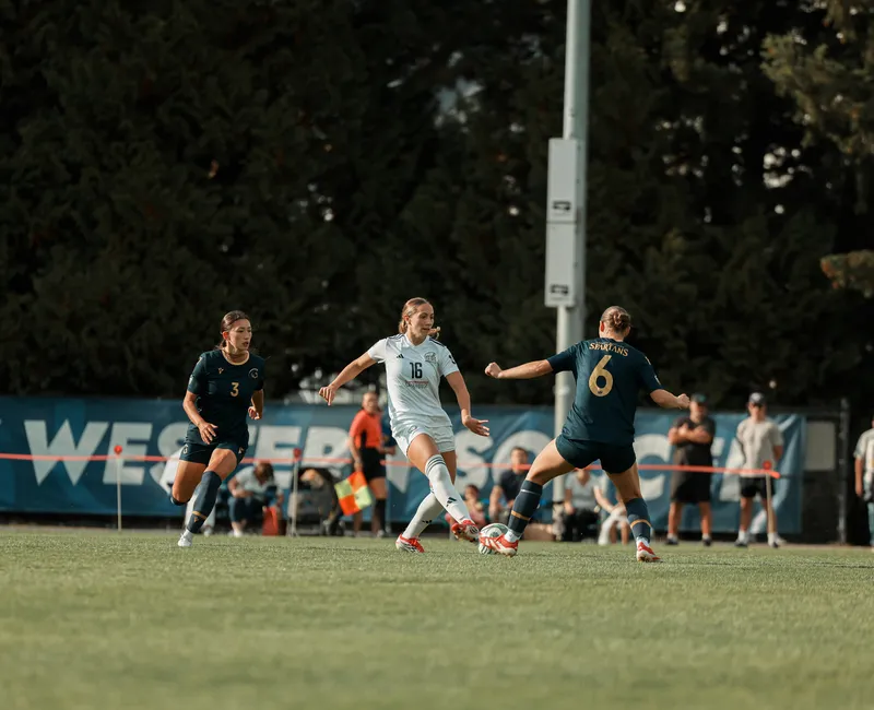 UBC midfielder alone trying to get pass the Spartans'defence.