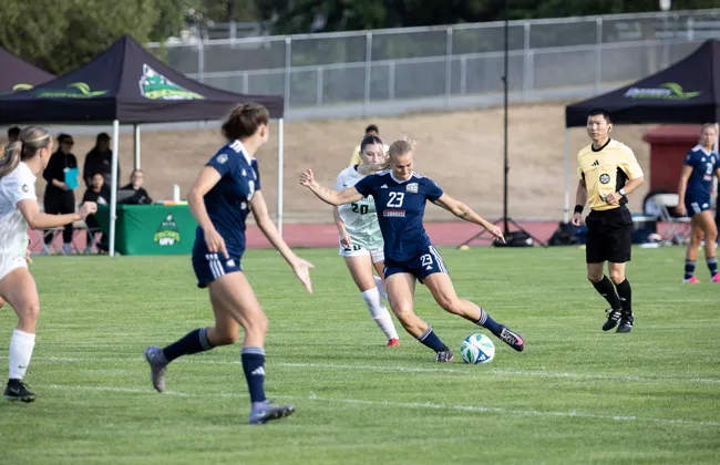 A UBC player takes a shot at the goal