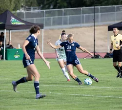 A UBC player takes a shot at the goal.