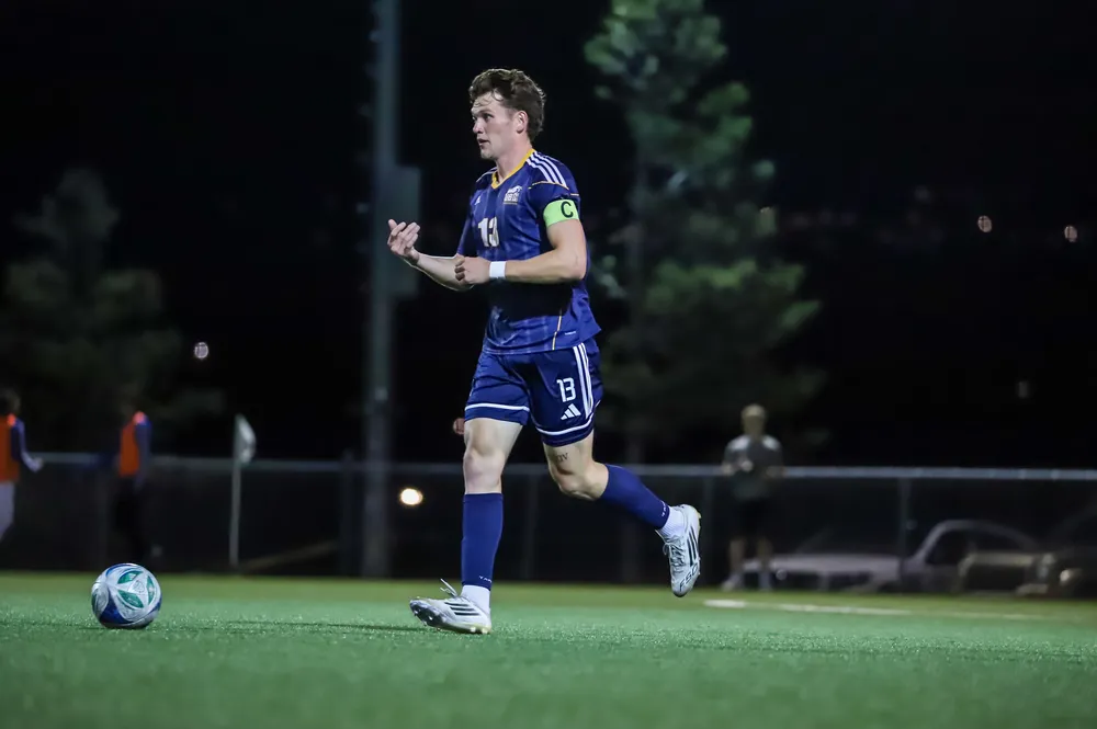 A UBC player sets up a play with the ball in possession.
