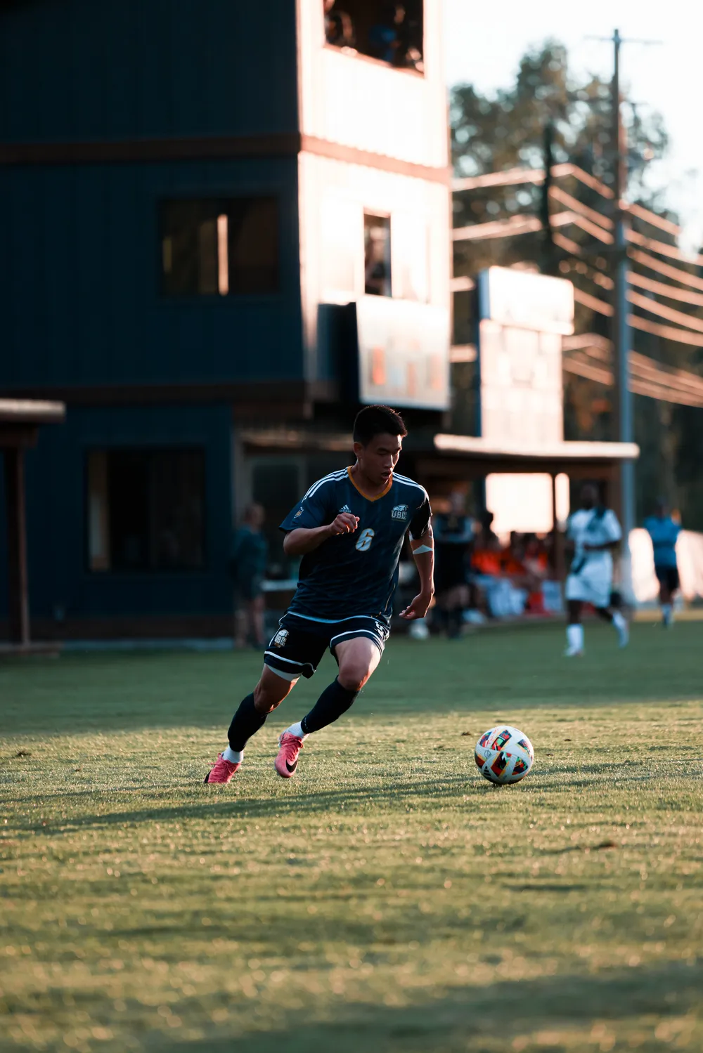 Yuan runs up field with the ball