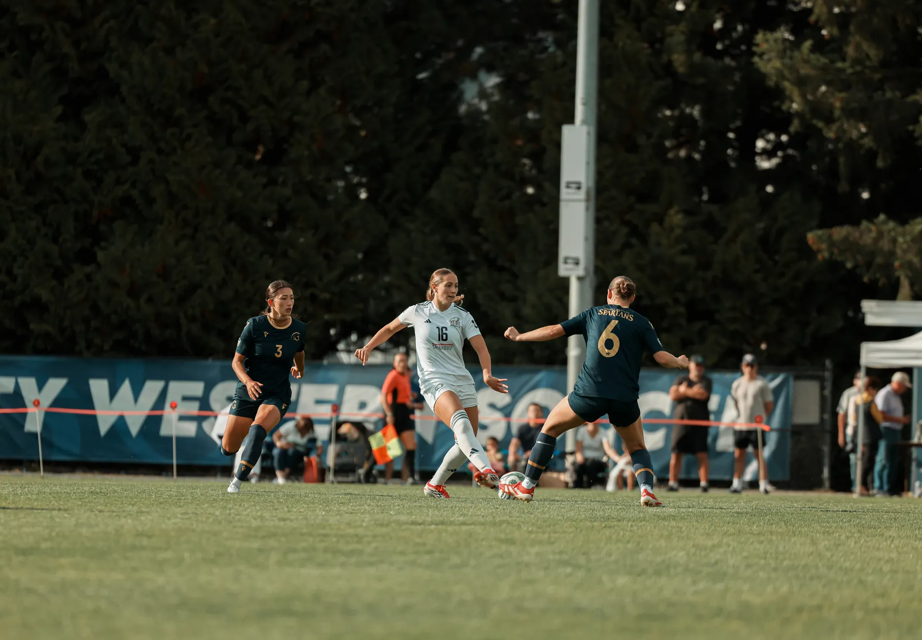 UBC midfielder alone trying to get pass the Spartans'defence.