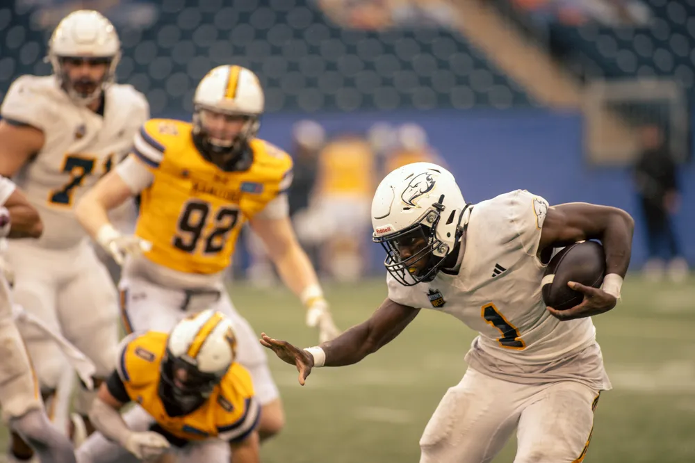 A UBC player runs with the ball
