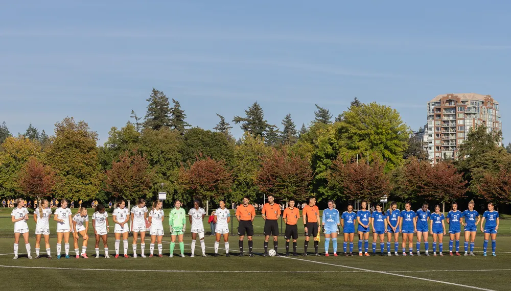 UBC and UBCO line up before kickoff.