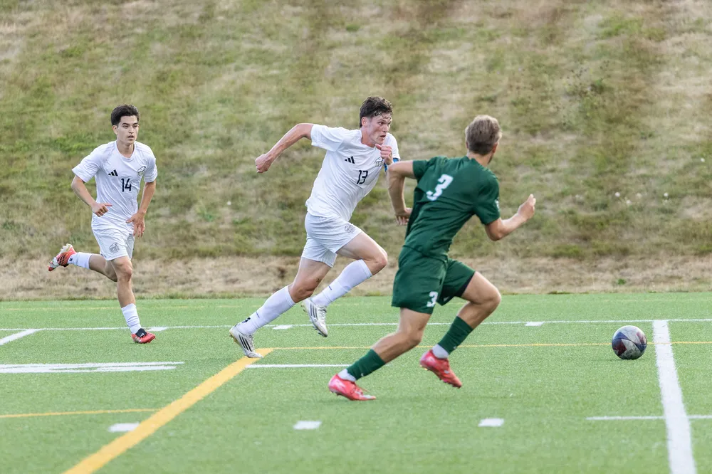 Lajeunesse chases after a ball, with a Cascade in hot pursuit.