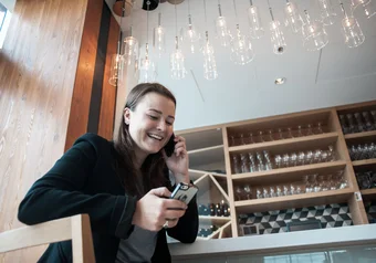 Veronica Knott using two phones during a photoshoot at the Perch restaurant in the New Sub.