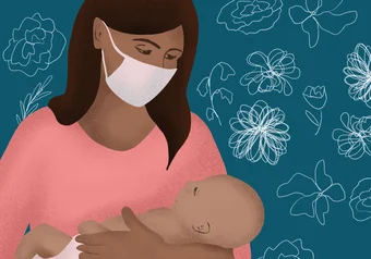 Mother wearing mask holding child