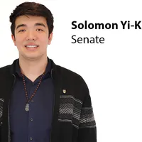 A photo of Senate candidate Solomon Yi-Kieran against a white background with text next to him that states his name.