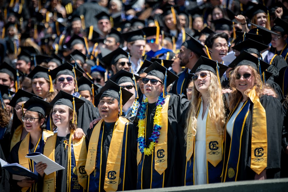 Cal Band graduates pose while singing the alma mater