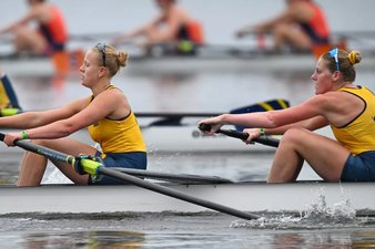 Image of two women rowing in a race
