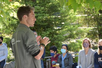 image of campus ambassador leading a tour group