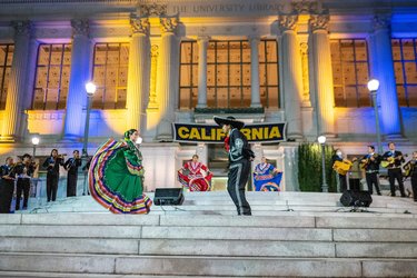 Cal student group performing on the steps of Doe Library