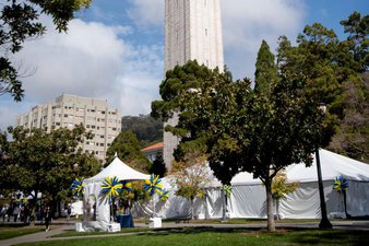 Homecoming Headquarters tents by the Campanile clock tower