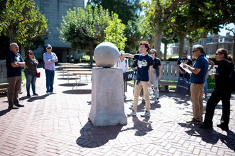 image of campus ambassador leading tour group