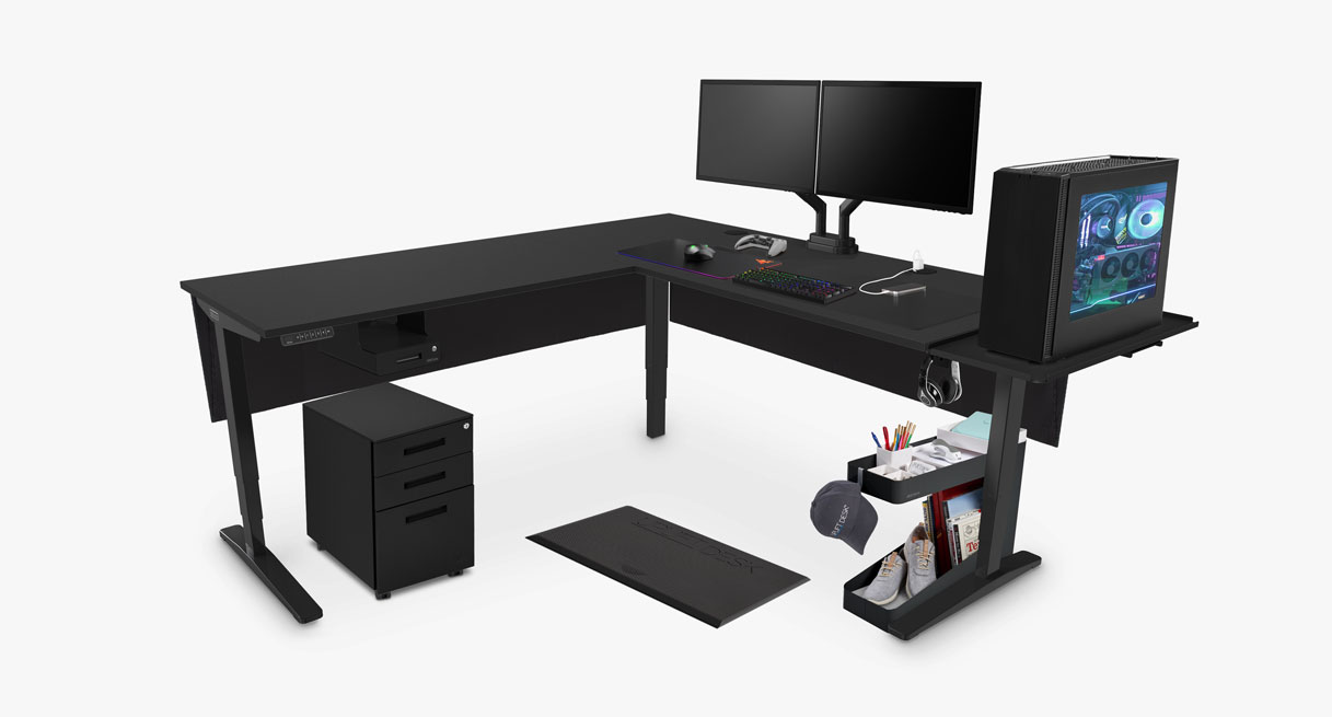 Black Laminate L-Shaped UPLIFT sit stand gaming desk with Mobile Storage Caddy, 3-Drawer Square File Cabinet, and Under Desk Shelf