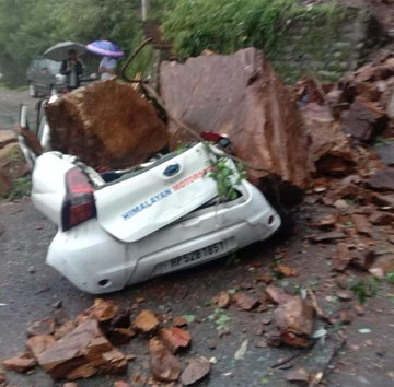 Himachal Pradesh: A landslide has occurred on Vikas Nagar-Panthaghati road in Shimla. A car parked alongside the road has been damaged. No other loss was reported: District Disaster Management Authority Shimla.