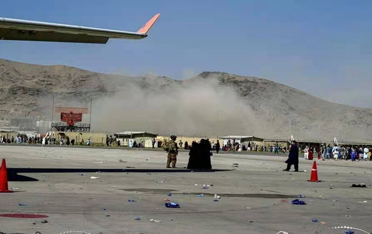 At least 60 civilians and 13 US troops killed in suicide attacks outside Kabul airport in Afghanistan