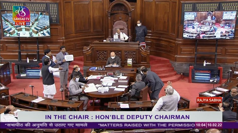 TRS MPs protest in the Well of the Rajya Sabha over PM Narendra Modi's statement in the House on 8th Feb on the passing of Andhra Pradesh Reorganisation Bill.