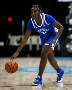 Photo shows Adebola Adeyeye playing basketball for the Kentucky Wildcats