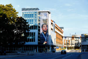 Photo shows Gerek Meinhard's picture on the large display screen on South Limestone.