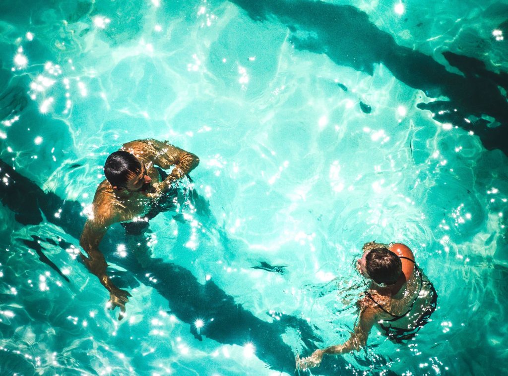 man and a woman in a swimming pool