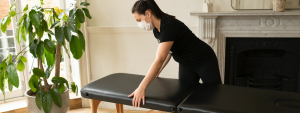 massage therapist wearing a mask