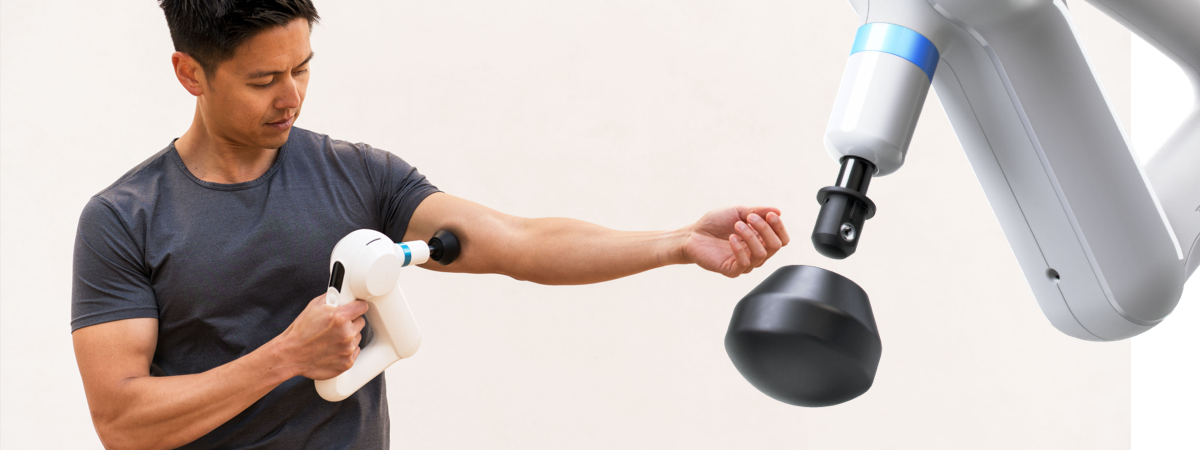 Image of a male using the white theragun on his upper bicep.