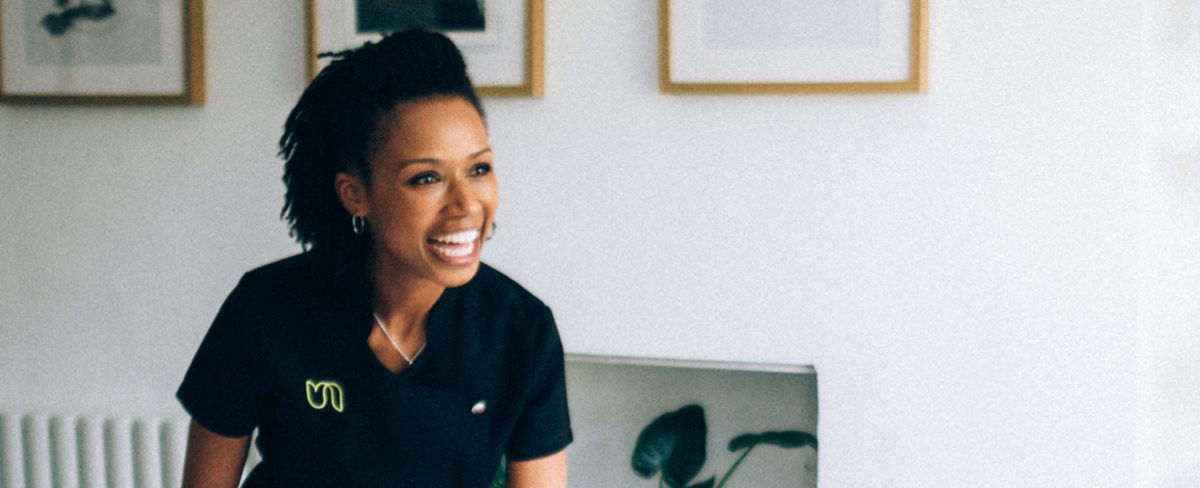 Close up of an happy Urban therapist, she is looking off camera and laughing