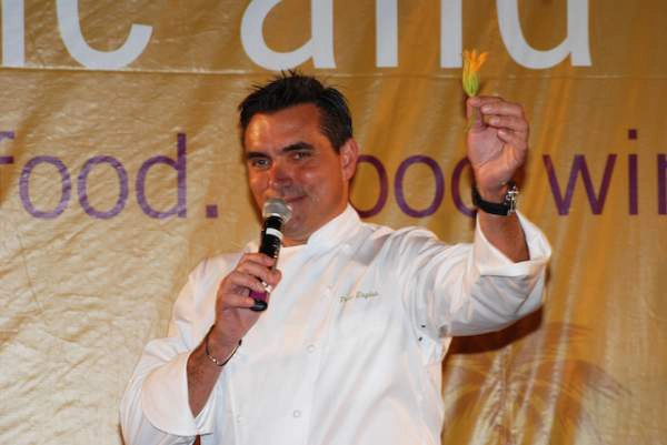 Chef speaking into microphone during event