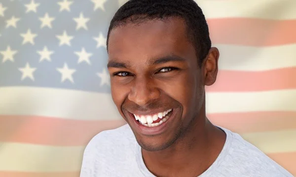 Men smiling in with the USA flag as background