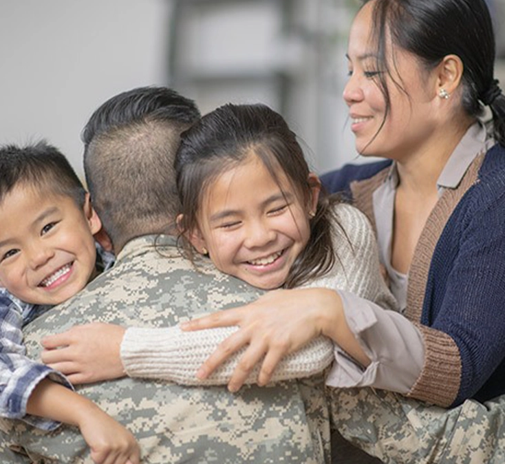 war veteran hugging his family