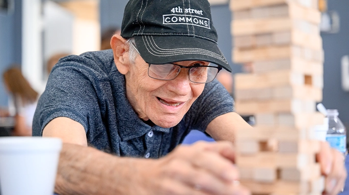 senior adult playing jenga