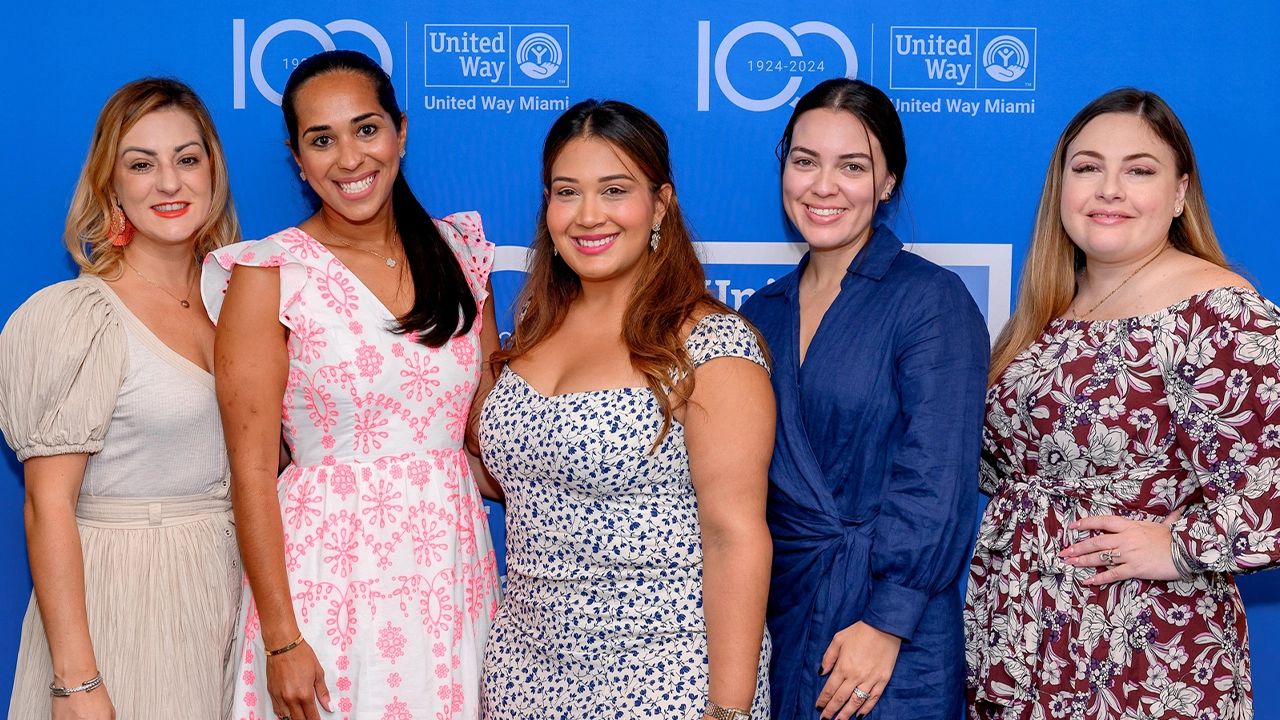 seven women showing diplomas