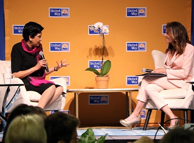 Women speaking during a talk to the public at United Way.