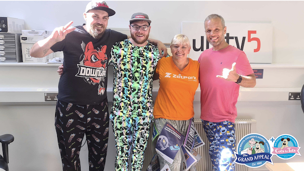Unity5 staff taking part in Cots 4 Tots Wrong Trousers charity day - four staff wearing colourful trousers Unity5 staff taking part in Cots 4 Tots Wrong Trousers charity day - four staff wearing colourful trousers