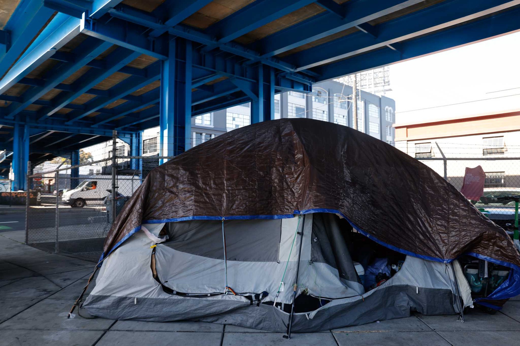 A tent is seen under the Central Freeway along Division Street next to Showplace Square on Tuesday, May 7, 2024 in San Francisco, Calif.