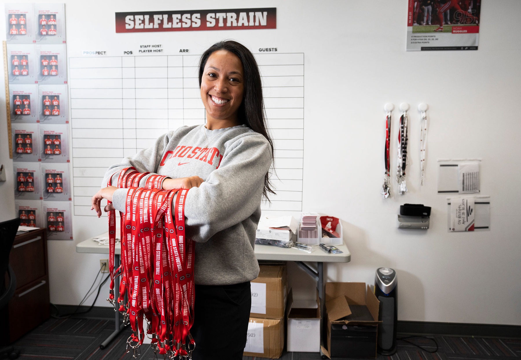 Jul 24, 2023; Columbus, OH, USA; Erin Dunston, Director of On-Campus Recruiting, holds two arm-fulls of lanyards in her office at Woody Hayes Athletic Center.