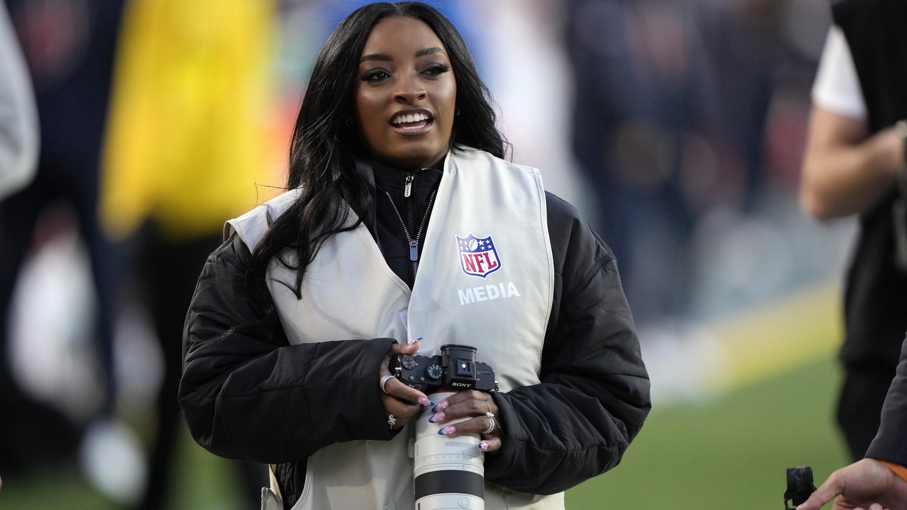 Particle: Simone Biles Works the Sideline as NFL Guest Photographer at ...